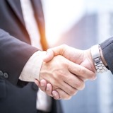Image of compliance / Business person shaking hands
