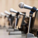 Image of shareholder meeting / Microphone on the podium